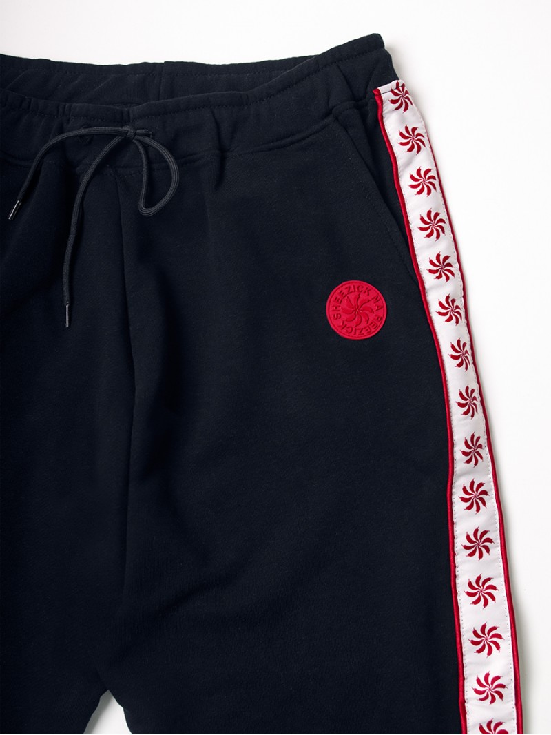 Pepper Sun, black track pants